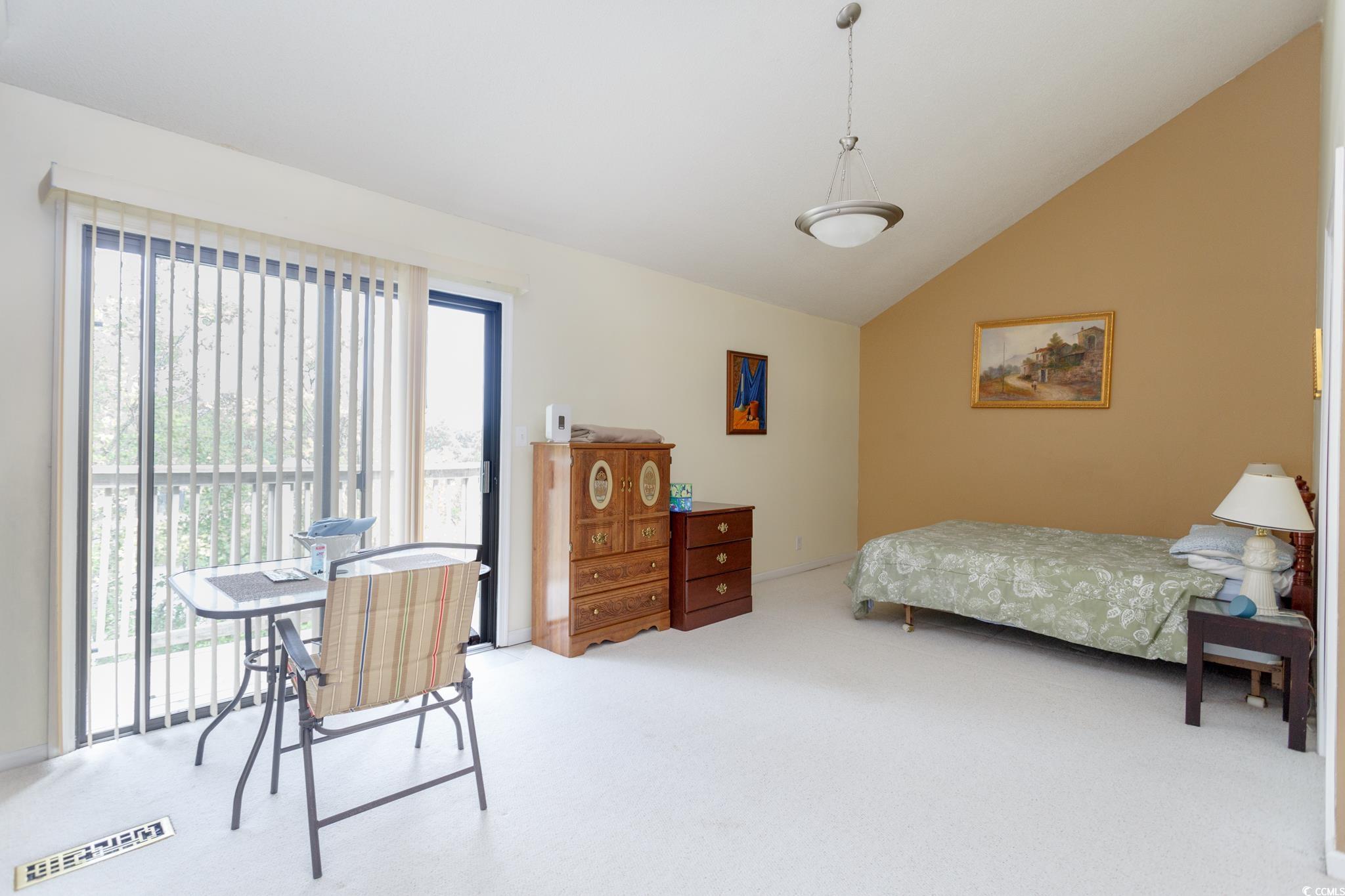 1356 Glenns Bay Road, Unit 201B Surfside Beach, SC 29575 - Photo 31 of 37 Bedroom featuring carpet, access to outside, and l