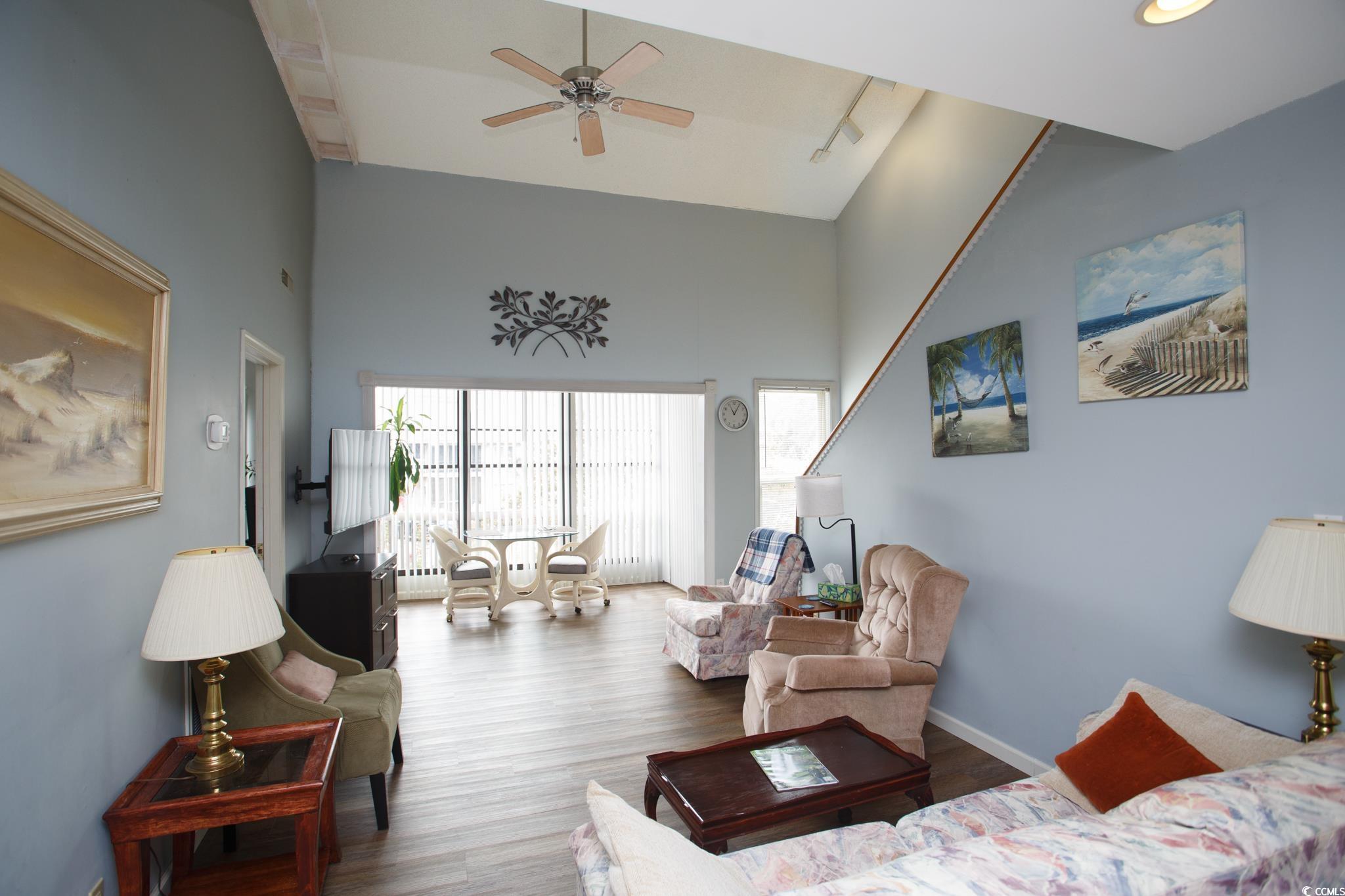 1356 Glenns Bay Road, Unit 201B Surfside Beach, SC 29575 - Photo 5 of 37 Living room with wood finished floors, a ceiling f
