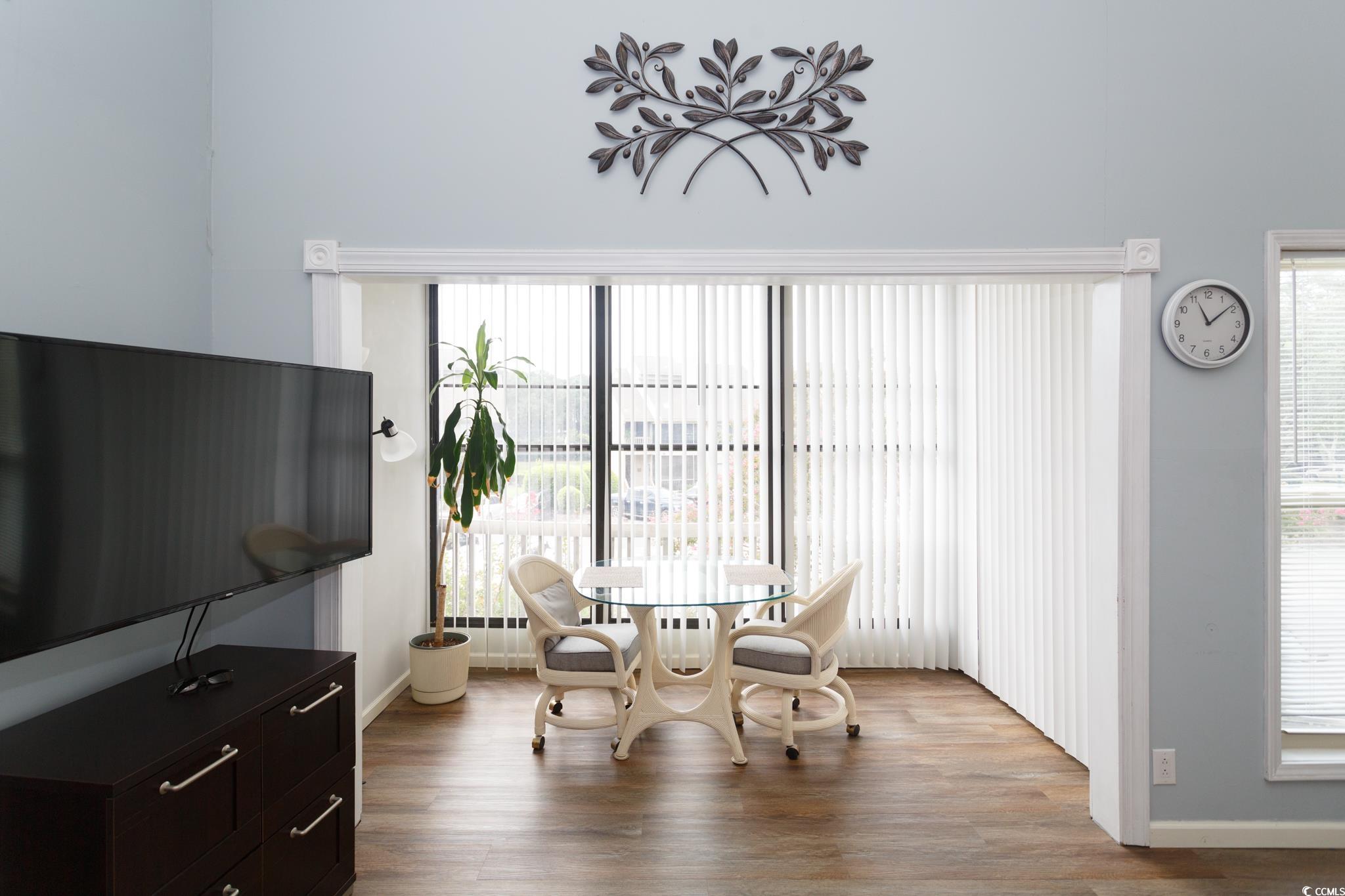 1356 Glenns Bay Road, Unit 201B Surfside Beach, SC 29575 - Photo 6 of 37 Dining area with wood finished floors