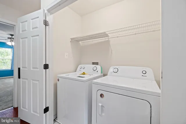 a view of storage and utility room with washer and dryer