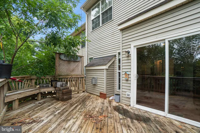 a view of a wooden deck with a yard