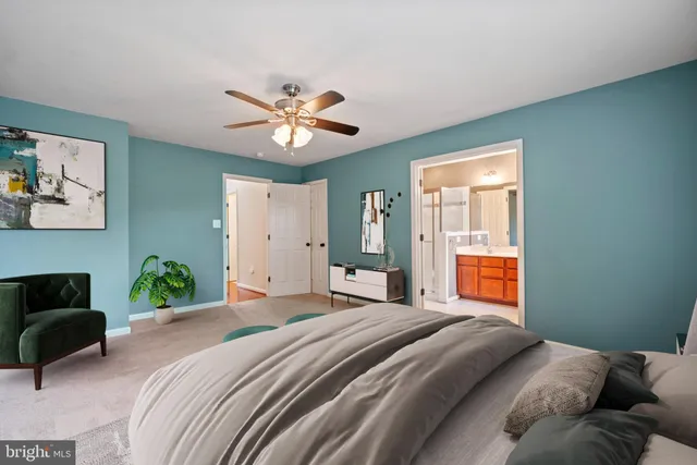 a bedroom with a bed dresser and a window