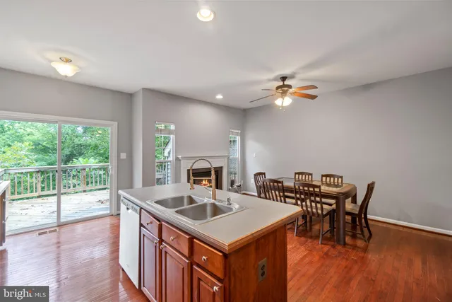 a kitchen that has a table chairs and a stove