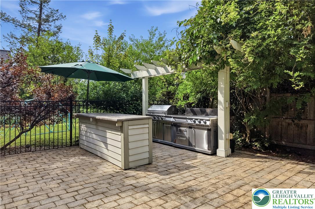 2014 Linden Street Bethlehem, PA 18017 - Photo 58 of 85 An inviting outdoor kitchen area on a paver patio provides the perfect setting for al fresco dining.