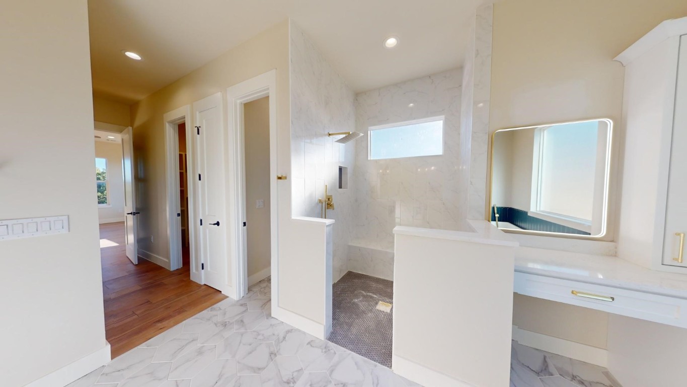 17307 West Reed Park Road Leander, TX 78645 - Photo 18 of 19 a bathroom with a sink and a mirror