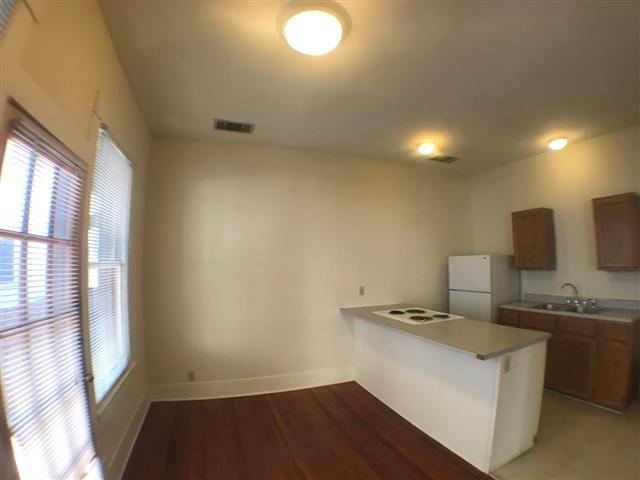 2307 Rio Grande Street, Unit B Austin, TX 78705 - Photo 4 of 8 Functional kitchen offers essential appliances and ample counter space for daily living.