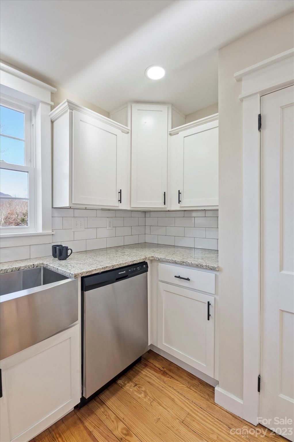 969 Peniel Road Columbus, NC 28722 - Photo 12 of 32 a white kitchen with a sink and cabinets