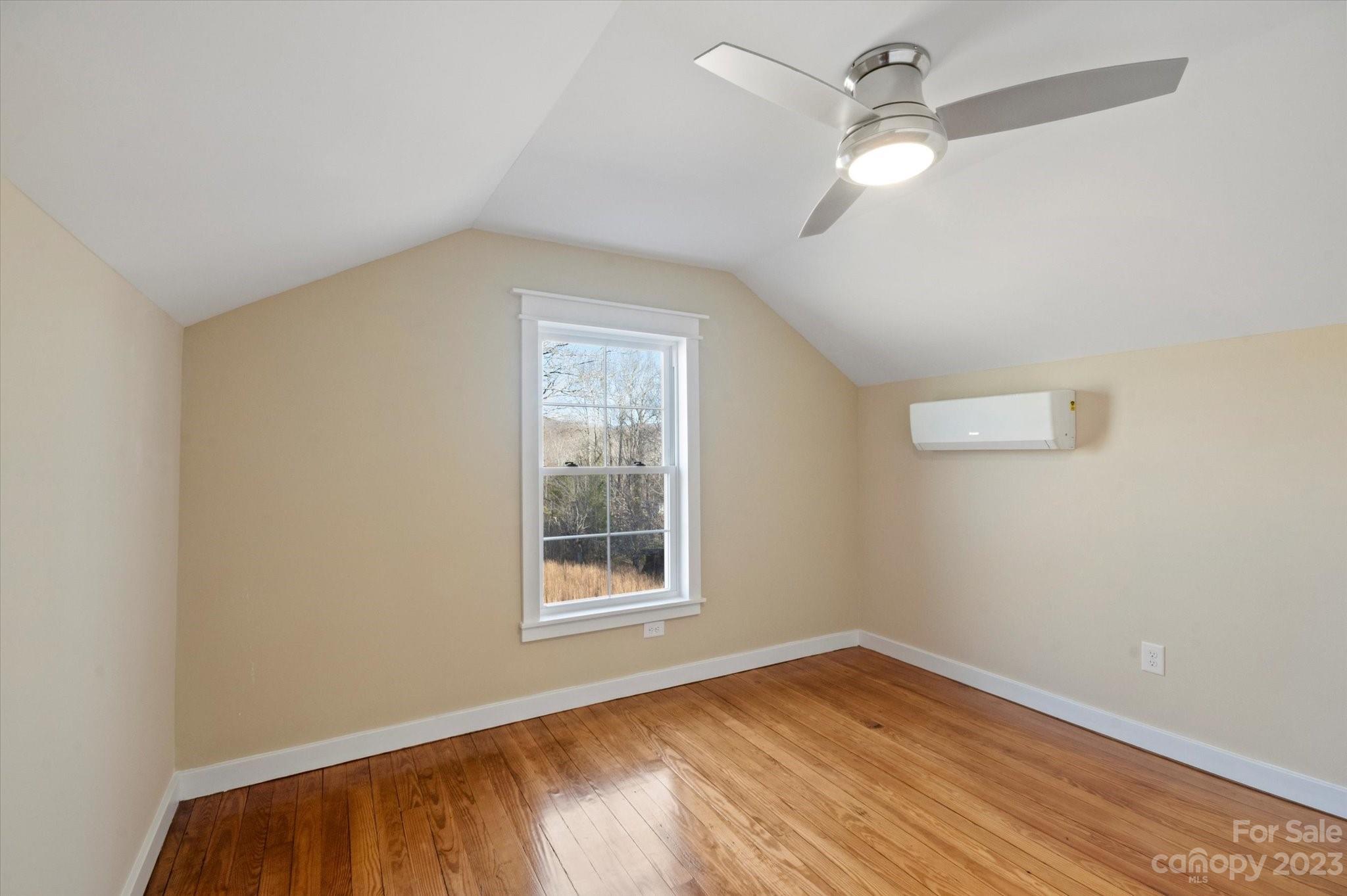 969 Peniel Road Columbus, NC 28722 - Photo 21 of 32 an empty room with a window and a fan