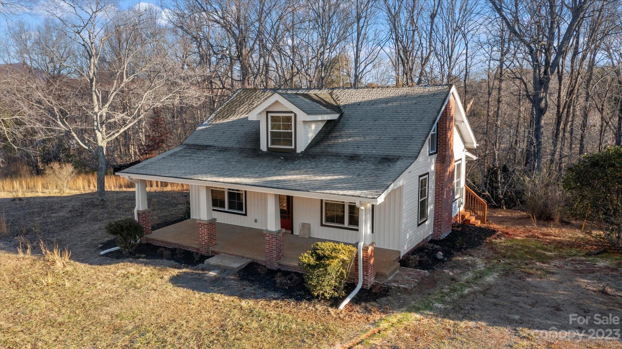 969 Peniel Road Columbus, NC 28722 - Photo 31 of 32 a view of a house with a yard