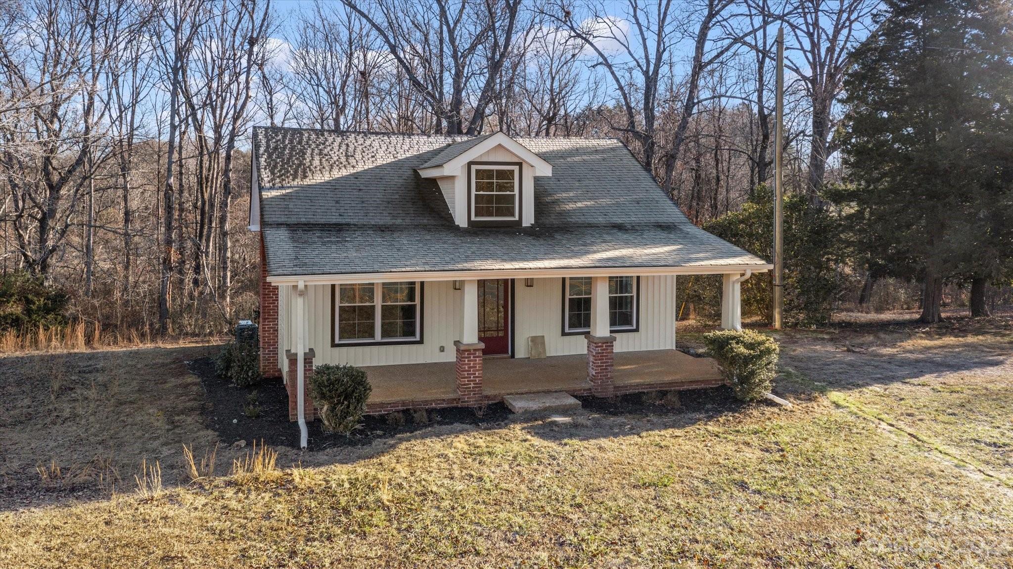 969 Peniel Road Columbus, NC 28722 - Photo 4 of 32 a front view of a house with a yard