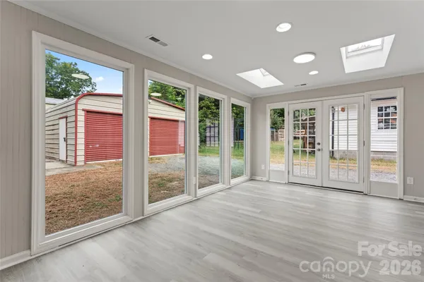 a view of an entryway with wooden floor