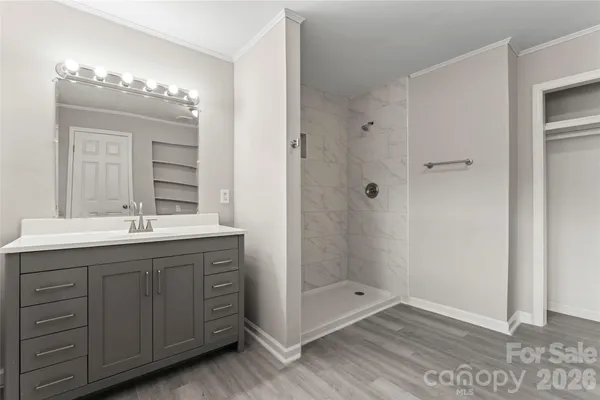 a bathroom with a double vanity sink and mirror