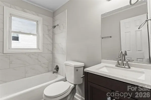 a bathroom with a sink a toilet and a bathtub