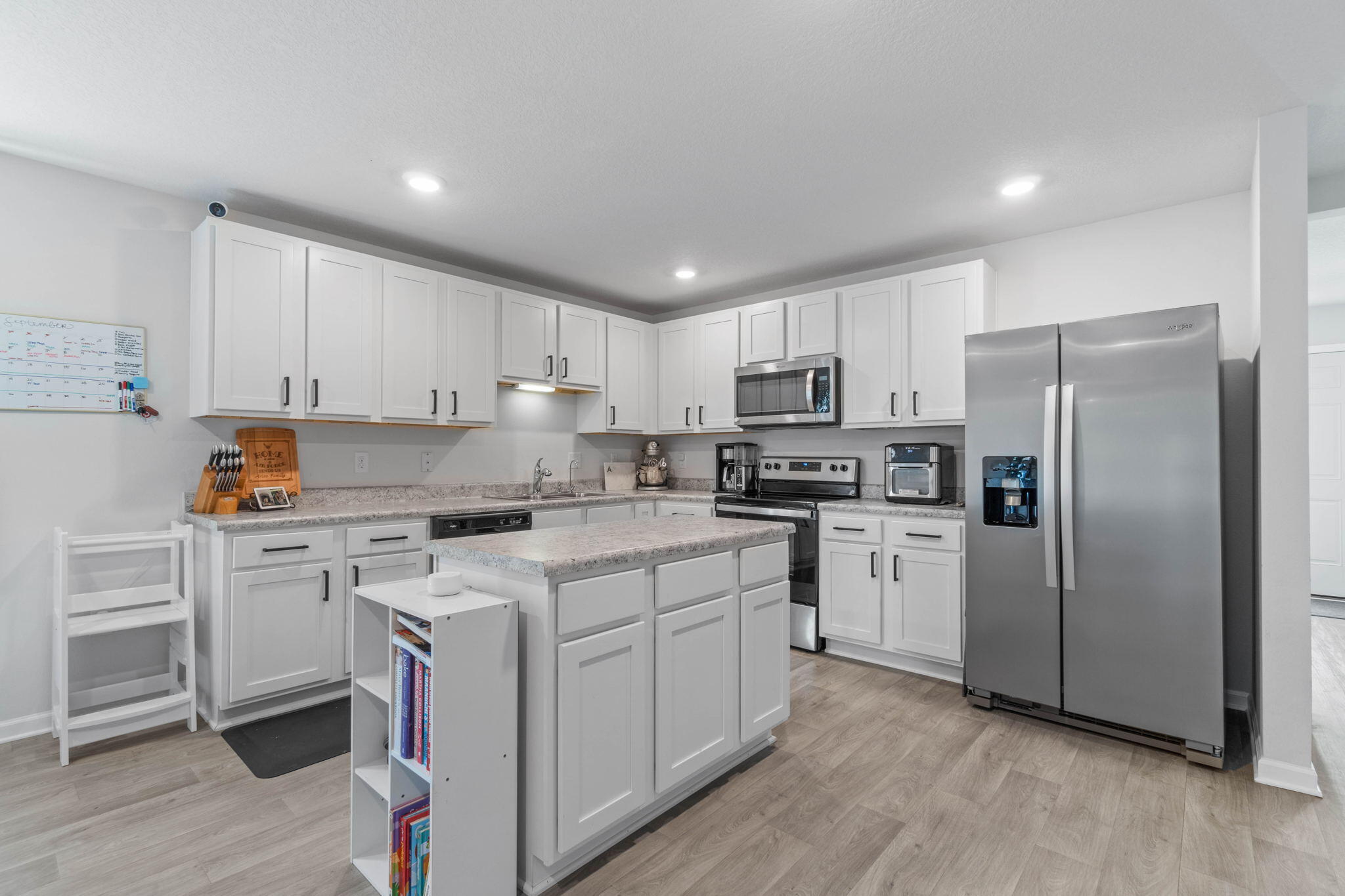 82 American Court Santa Rosa Beach, FL 32459 - Photo 13 of 47 a kitchen with cabinets stainless steel appliances and a counter space