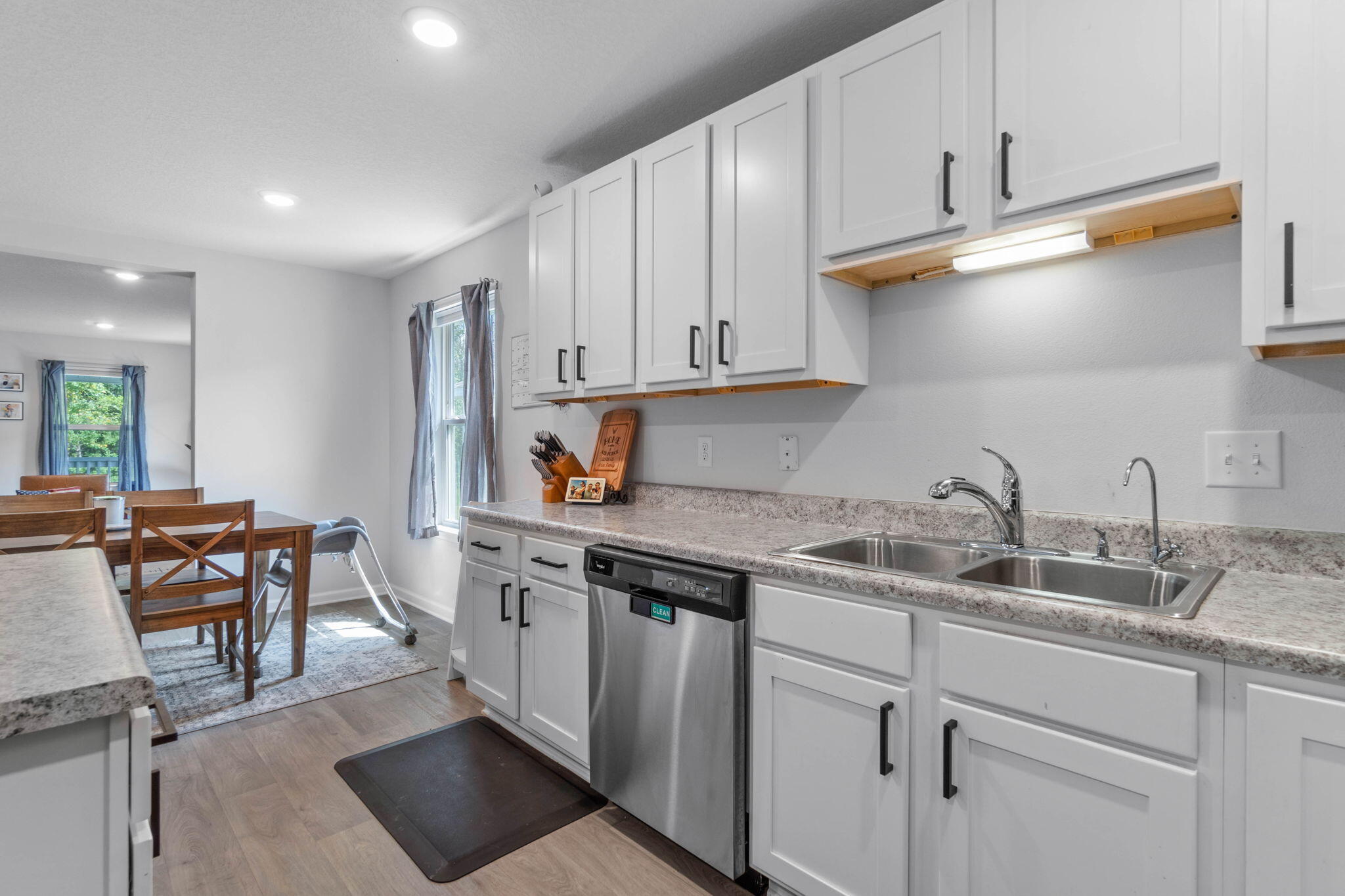 82 American Court Santa Rosa Beach, FL 32459 - Photo 15 of 47 a kitchen with stainless steel appliances granite countertop a sink stove and cabinets