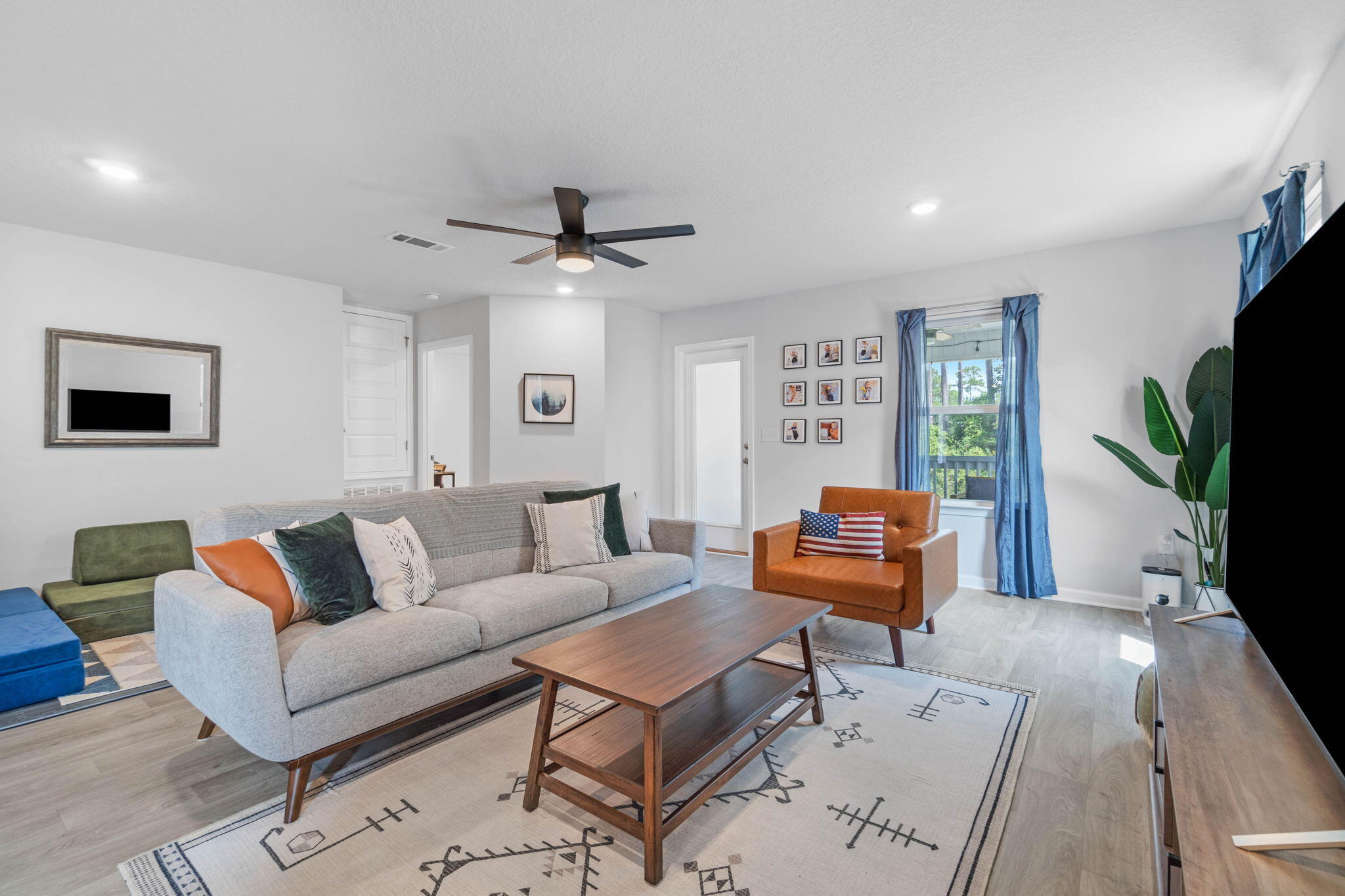 82 American Court Santa Rosa Beach, FL 32459 - Photo 20 of 47 a living room with furniture and a flat screen tv