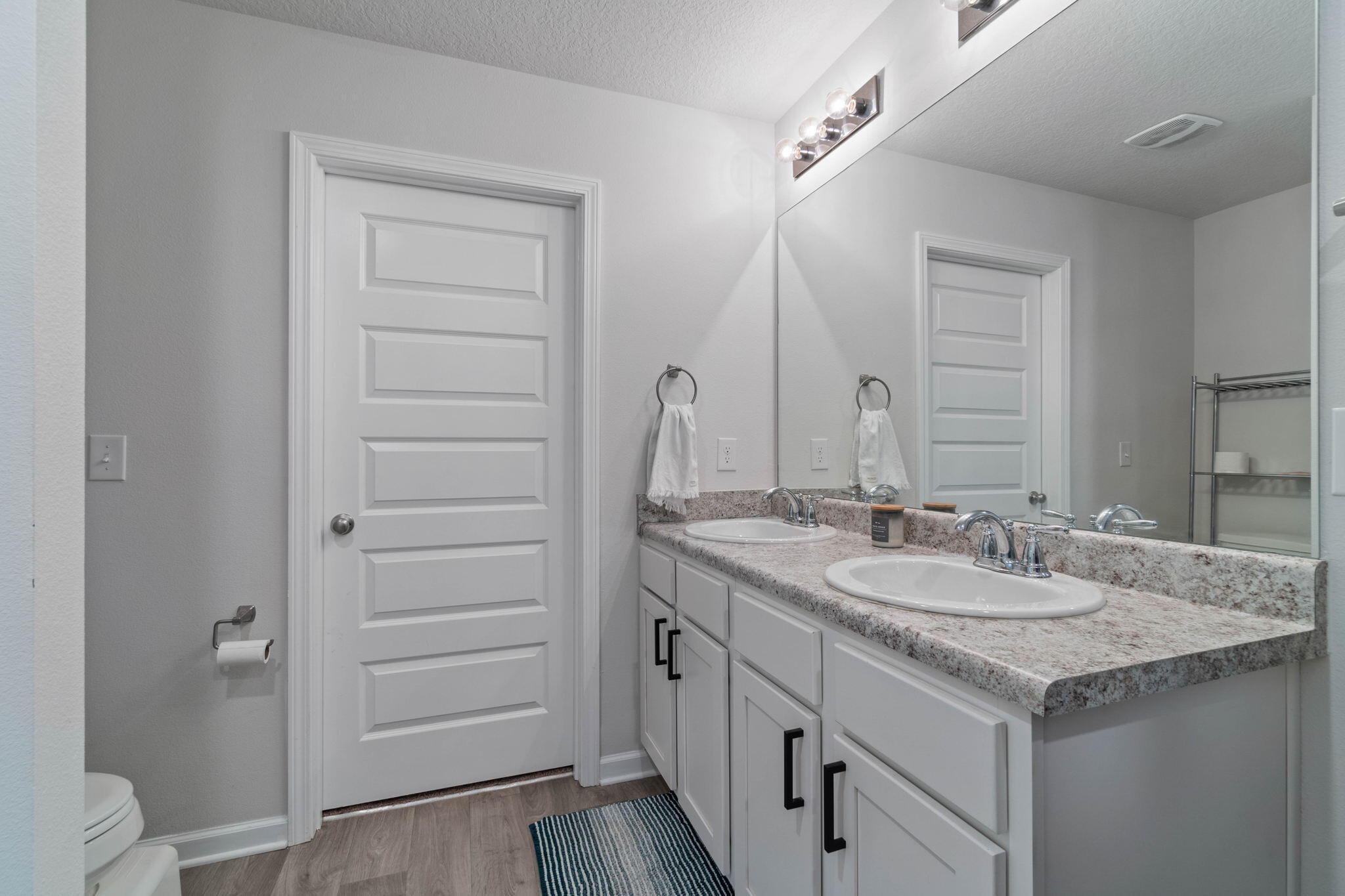 82 American Court Santa Rosa Beach, FL 32459 - Photo 25 of 47 a bathroom with a granite countertop sink and a mirror