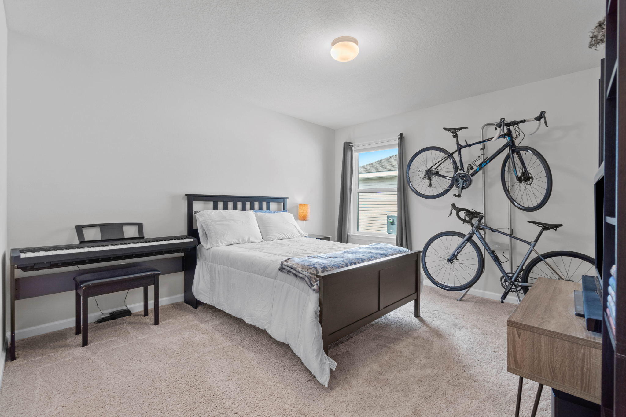 82 American Court Santa Rosa Beach, FL 32459 - Photo 28 of 47 a bedroom with bed and a chandelier