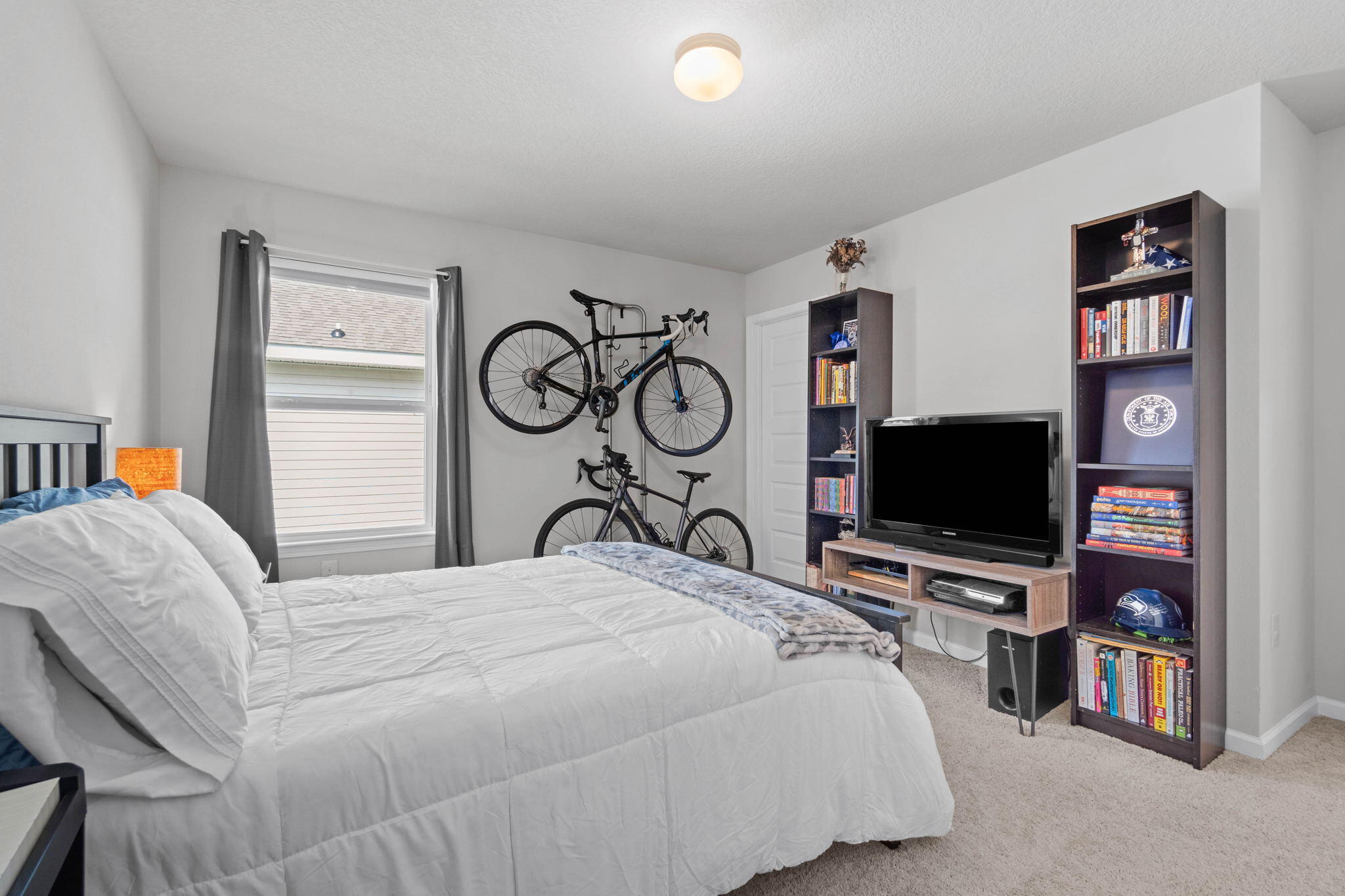 82 American Court Santa Rosa Beach, FL 32459 - Photo 29 of 47 a bedroom with a bed and a flat tv screen on the dresser