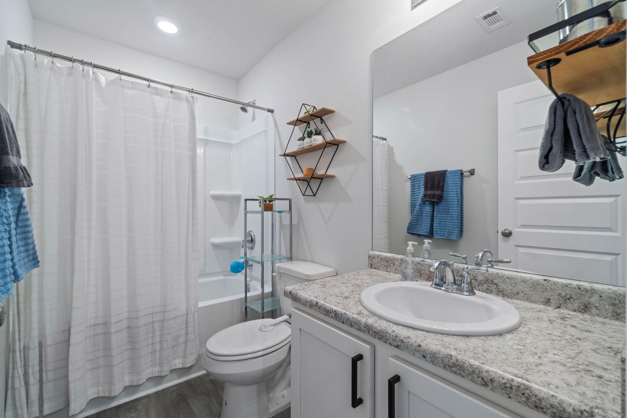 82 American Court Santa Rosa Beach, FL 32459 - Photo 30 of 47 a bathroom with a granite countertop sink toilet and shower