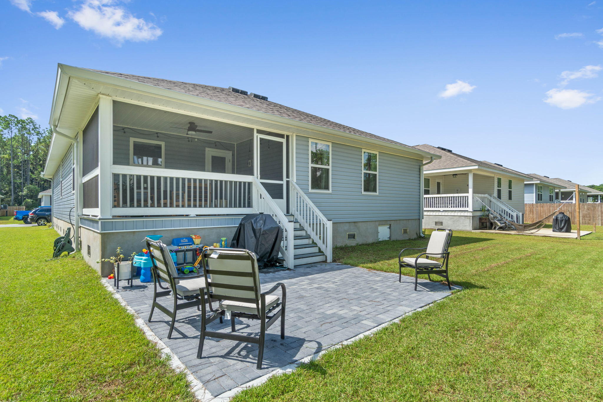 82 American Court Santa Rosa Beach, FL 32459 - Photo 37 of 47 a view of a house with backyard sitting area and garden