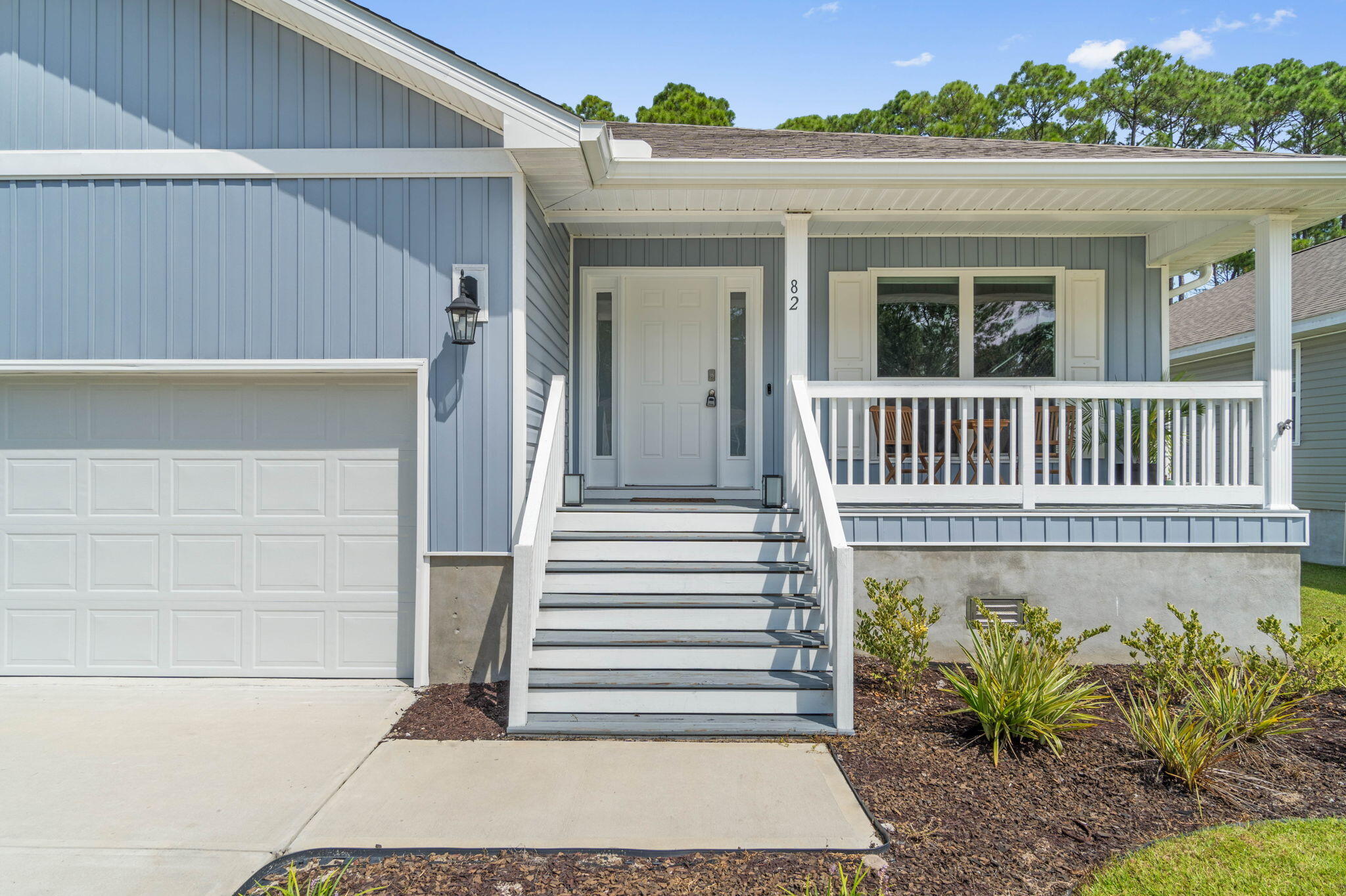 82 American Court Santa Rosa Beach, FL 32459 - Photo 4 of 47 a view of a brick house with a yard