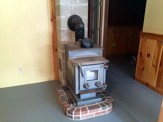 21 Tuttle Road Cornville, ME 04976 - Photo 12 of 35 Family room with wood stove