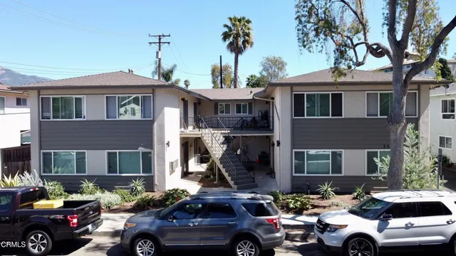 a front view of a house with parking space