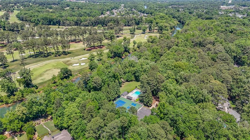 3712 Frederica Road Northwest Berkeley Lake, GA 30096 - Photo 49 of 49 an aerial view of residential houses with outdoor space and trees