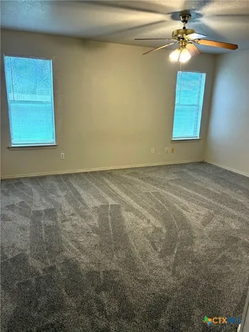 a view of an empty room and window