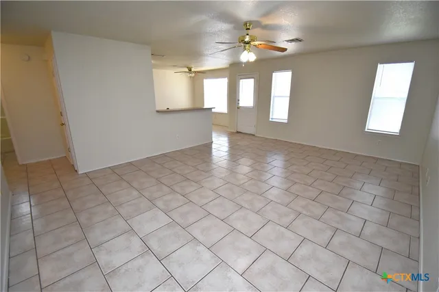 a view of an empty room and window