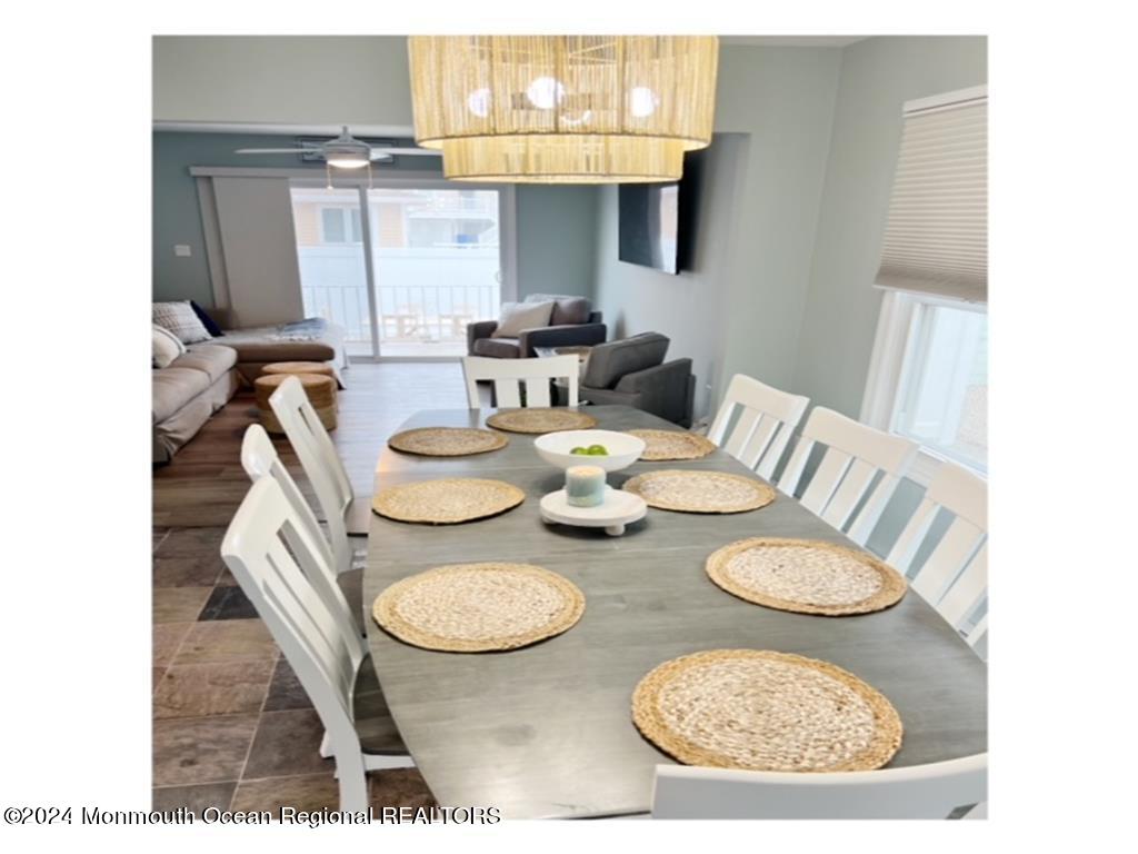 308 Harding Avenue, Unit WKLY SUMMER RENTAL Seaside Heights, NJ 08751 - Photo 11 of 25 a dining room with furniture and a table