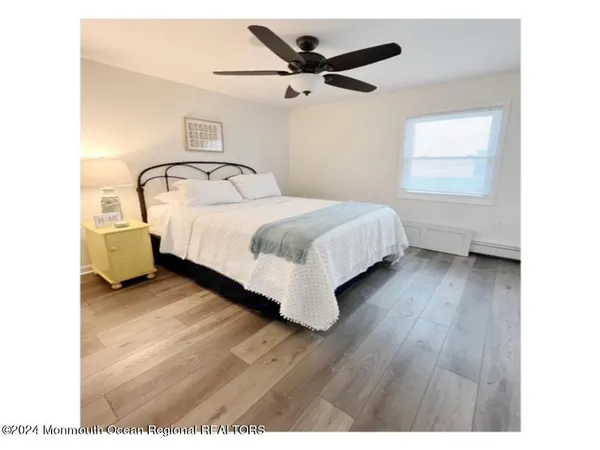 a bed room with a bed and a window