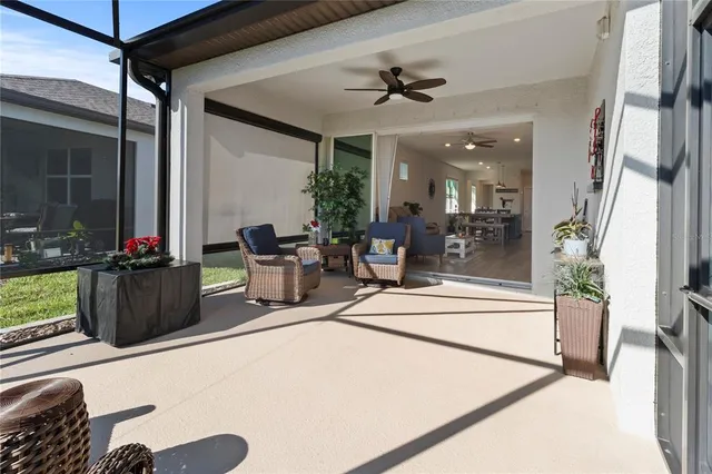 an aerial view of residential houses with outdoor space and swimming pool