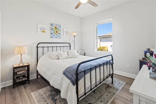 a kitchen with kitchen island white cabinets and stainless steel appliances