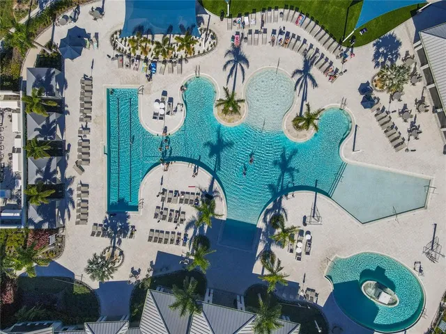 a kitchen with stainless steel appliances white cabinets and wooden floor