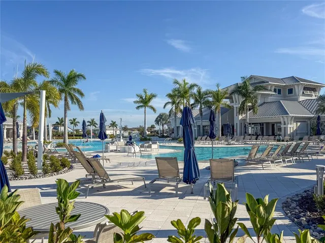 a bathroom with a sink a toilet a tub and shower