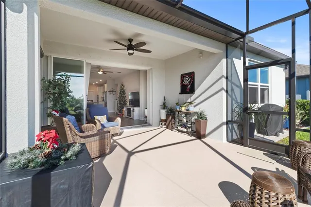 a bedroom with a large bed and a flat tv screen on dresser