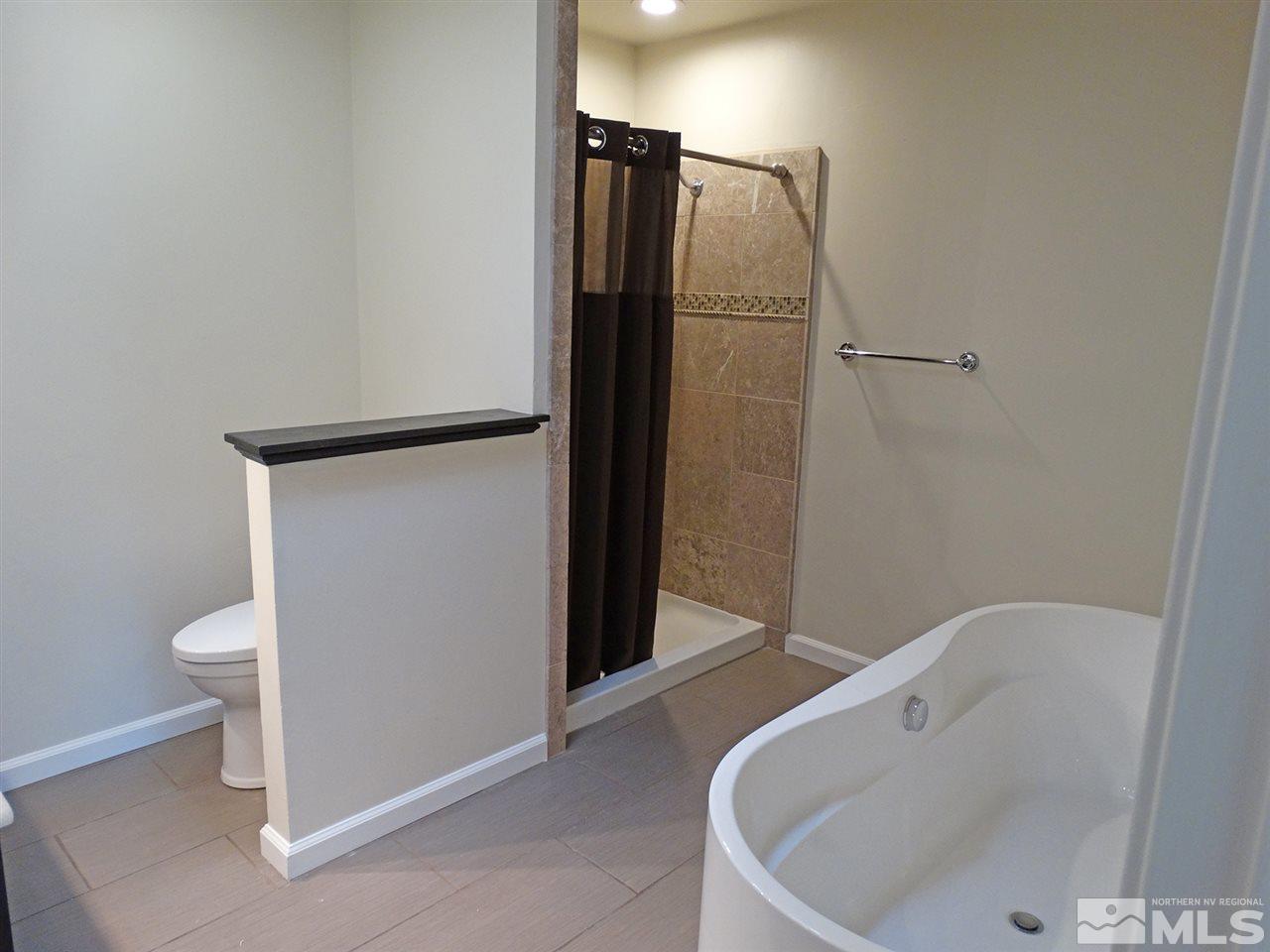 1336 Jones Street Reno, NV 89503 - Photo 20 of 24 a bathroom with a bathtub and toilet