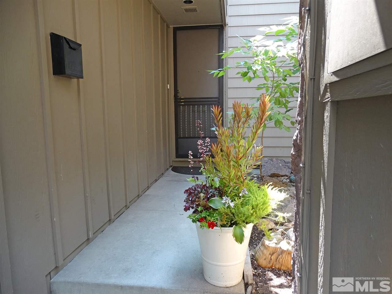 1336 Jones Street Reno, NV 89503 - Photo 2 of 24 a potted plant sitting in front of a window