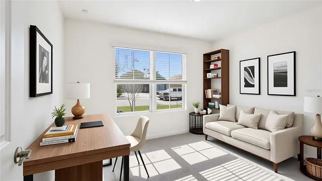 a living room with furniture and next to a window