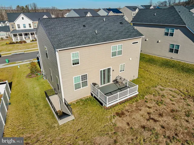 a aerial view of a house with swimming pool