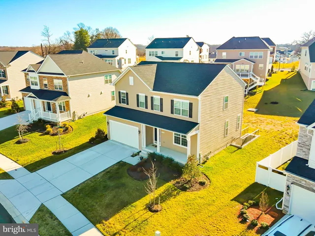 an aerial view of a house with a swimming pool