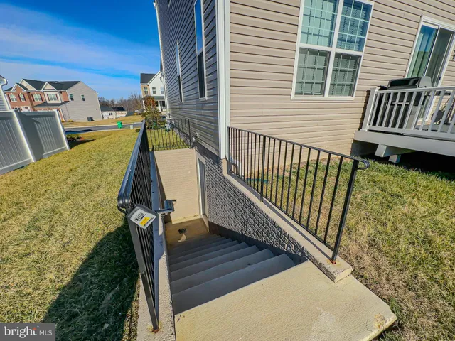 a view of a balcony with wooden floor and fence