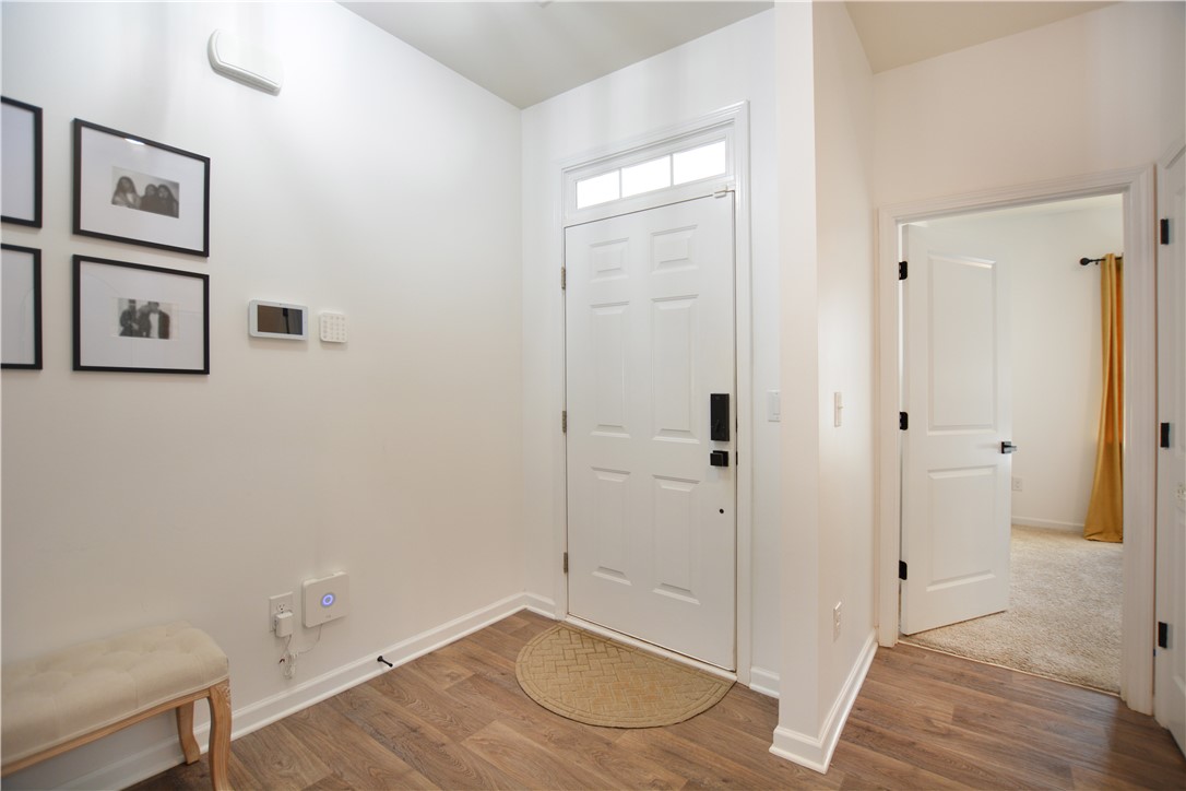 242 Hillendale Way Pelzer, SC 29669 - Photo 2 of 19 Step inside this inviting entry with warm wood flooring and bright white trim.