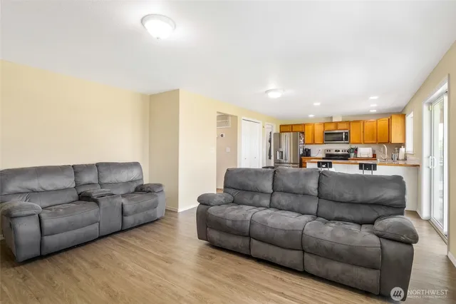 a bathroom with a sink a toilet and shower curtain