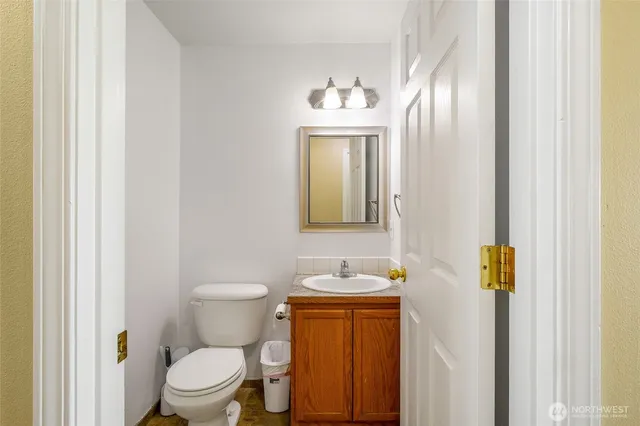 a kitchen with a refrigerator and cabinets
