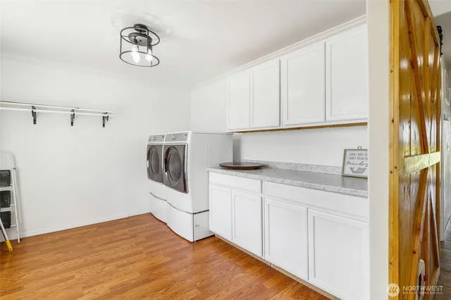 a view of a hallway with bathroom and a livingroom