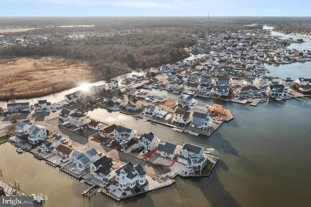 an aerial view of a house with a ocean view