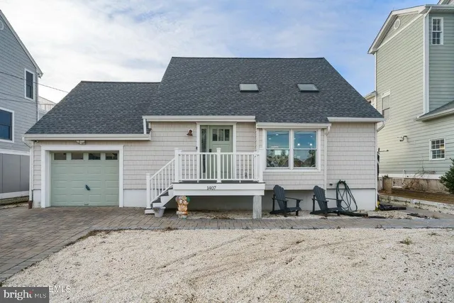 a front view of a house with a barbeque